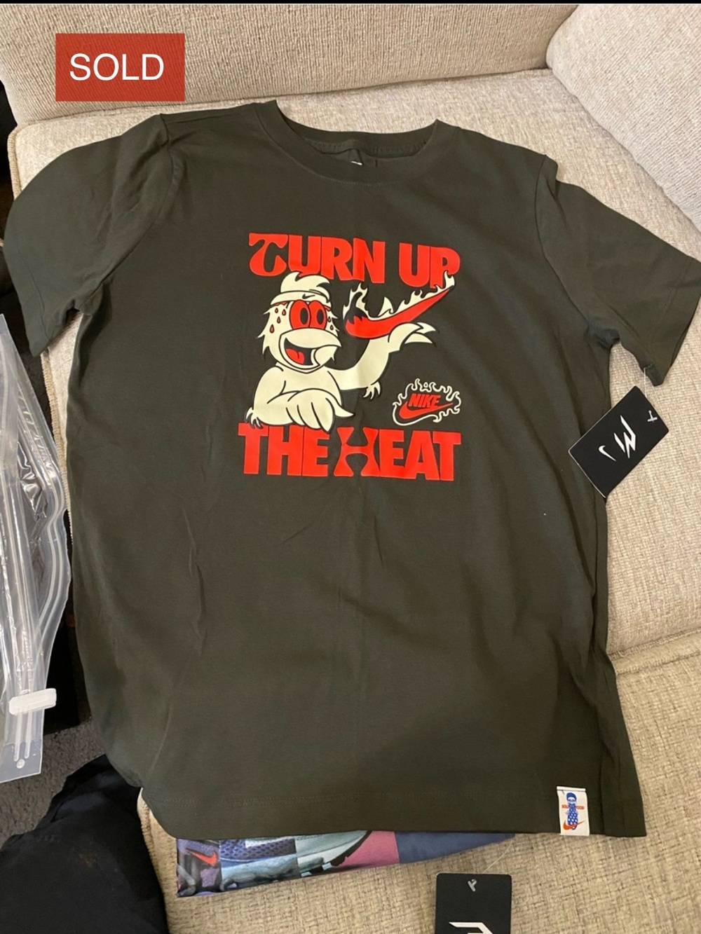 Nike Men’s Black Graphic Tee with Red and Cream Print